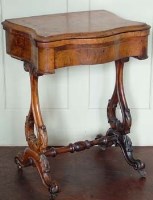 Lot 665 - Victorian walnut games table.