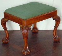 Lot 667 - Walnut stool on ball and claw feet.