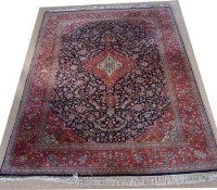 Lot 679 - Large Persian blue ground carpet