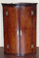 Lot 700 - Oak and mahogany corner cupboard.