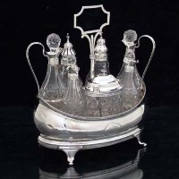 Lot 369 - Silver seven-bottle cruet