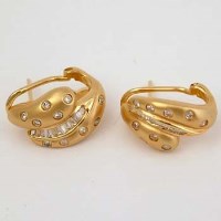 Lot 444 - Pair of round diamond and baguette ear clips.