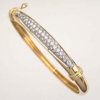Lot 467 - Yellow gold and diamond hoop bangle
