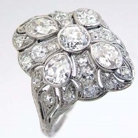 Lot 475 - Platinum and diamond cluster ring with pear cut