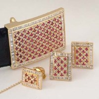 Lot 488 - 18ct gold diamond and ruby belt, pair of matching cufflinks and stud (4)
