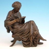 Lot 546 - Bronze figure of a lady reading