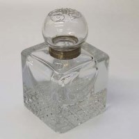 Lot 672 - Cut glass inkwell with monogramed lid