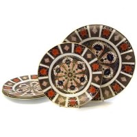 Lot 749 - Four Crown Derby side plates and one large plate