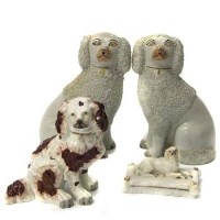 Lot 771 - Four Staffordshire dogs