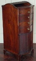 Lot 857 - George III mahogany serpentine front bachelors