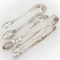 Lot 325 - Four silver sugar tongs