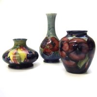 Lot 653 - Three medium size Moorcroft vases