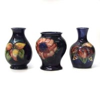 Lot 654 - Three small size Moorcroft vases