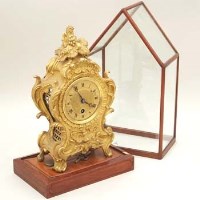 Lot 686 - Gilt mantel clock under glass dome