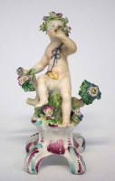 Lot 125 - Bow figure of a cherub circa 1750, modelled sat