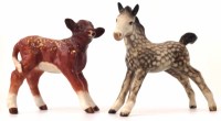 Lot 186 - Beswick rocking horse grey foal and a dairy