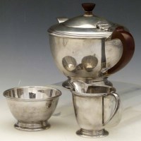 Lot 255 - Silver three piece tea set