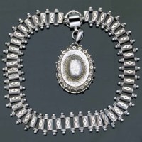 Lot 277 - Silver locket on chain.