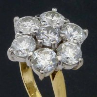 Lot 325 - Seven stone diamond cluster ring