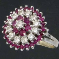 Lot 330 - Ruby and diamond circular cluster ring