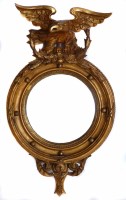Lot 588 - Circular gilt frame mirror topped with eagle