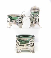 Lot 335 - Silver Art & Crafts design three piece cruet set