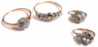 Lot 381 - Pair of diamond solitaire earrings and two rings