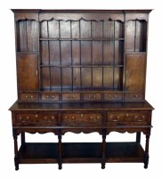 Lot 648 - 20th century oak dresser of George III design