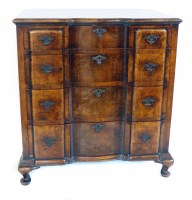 Lot 656 - A mid 20th century oak and walnut veneered chest of drawers