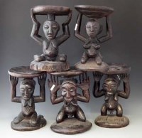 Lot 12 - Five Luba / Hemba caryatid stools, the largest