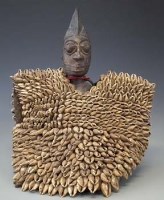 Lot 27 - Yoruba Ibeji figure, with large cowrie shell