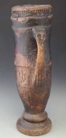Lot 83 - Chokwe drum, carved with a mask and arm handle