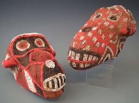 Lot 93 - Two Bamileke beadwork monkey heads, 23cm long