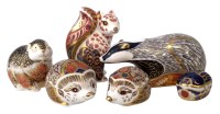Lot 106 - Six Royal Crown Derby paperweights, to include
