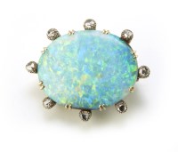 Lot 197 - A circa 1900 oval opal and diamond set brooch
