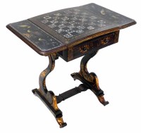 Lot 573 - Victorian black lacquered games table