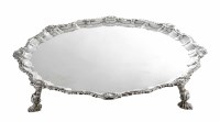 Lot 263 - Silver salver on four paw and scroll feet
