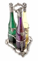 Lot 275 - A three-part silver plated tantalus, containing