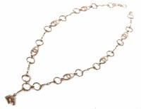 Lot 291 - 9ct rose gold horseshoe, bit and stirrup link necklace with drop horse head pendant