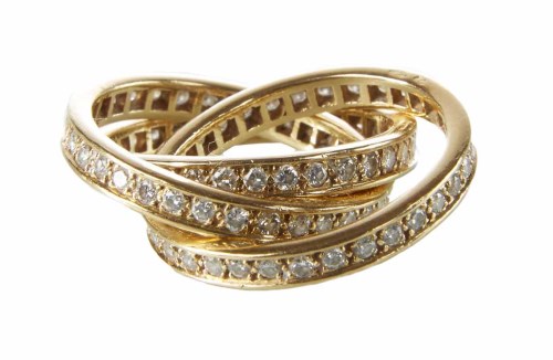 Lot 292 - Cartier 18ct gold diamond inter-locking 3 section ring
