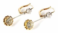 Lot 303 - A pair of diamond 2 stone 18ct yellow and white gold drop earrings