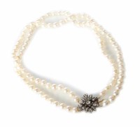 Lot 308 - A cultured pearl two row choker necklace with a diamond flower head clasp