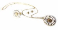 Lot 309 - George Jensen Silver gilt white enamelled suite of flower head pendant, ring and stud earrings.