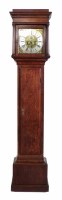 Lot 630 - An oak longcase clock