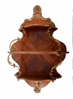 Lot 690 - 19th Century French Kingwood veneered three shelf wall bracket with ormolu mounts.