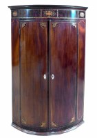 Lot 694 - George III mahogany corner cupboard.