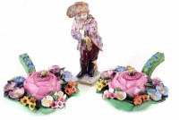 Lot 93 - German figure of a boy with iceskates and two