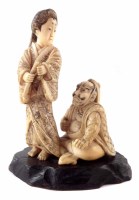 Lot 152 - 19th century Japanese ivory Okimono Woman and seated Man