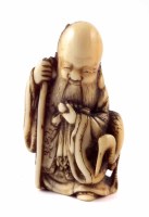Lot 171 - 19th century Japanese Netsuke Fukurokuju holding a staff accompanied by a crane.