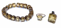 Lot 202 - A 9ct rose gold citrine line bracelet with matching single stone set ring and pendant, the bracelet comprising a total of 20 graduating octagonal mixe